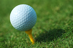 photo of golf ball near hole