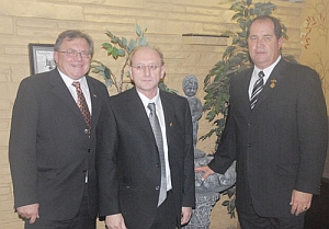 Celebrating the Belgian Club 60th anniversary gala, Mike Columbus (left), Delhi council representative and Marc Vanden Bussche, Delhi Belgian Club president, welcomed Paul DeVos, Council General of Belgium. Kaitlin Doherty / News-Record Photo